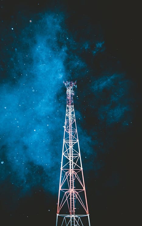 pexels-photo-2352277 A striking telecommunication tower stands beneath a vibrant starry night sky.